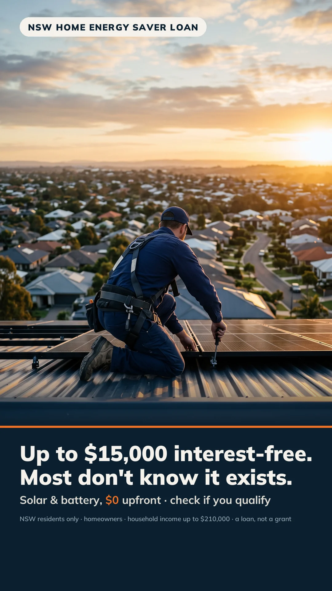 Solar installer seen from behind on a rooftop looking out over Australian suburban rooftops at sunrise