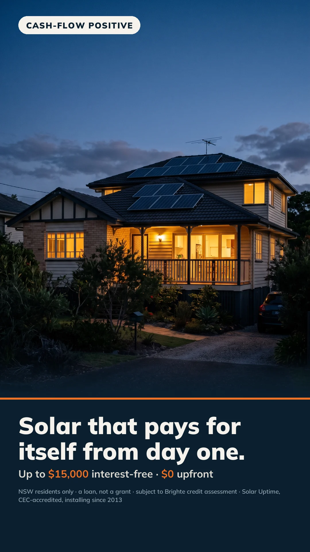 Australian home at dusk with warm interior lights glowing and rooftop solar silhouetted against a navy sky